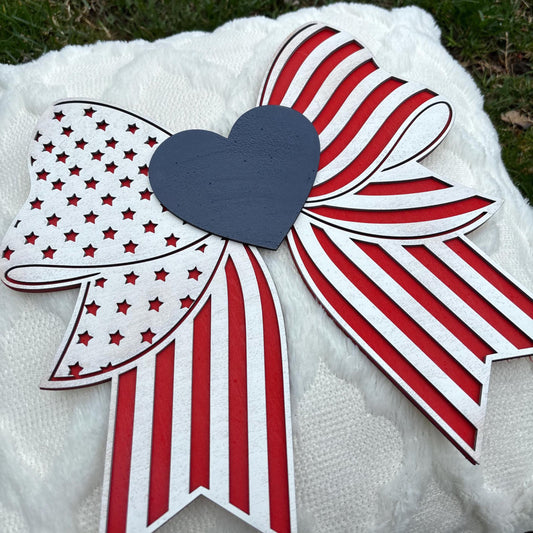 Patriotic Bow Wall Sign – Red, White & Blue Americana Decor | Handmade Wooden 4th of July Sign | Farmhouse Porch or Mantel Decoration USA
