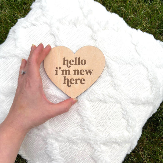 Wooden heart baby sign with “hello i’m new here” engraving Perfect for newborn photo props, flat lays, baby showers & birth reveals Girl Boy